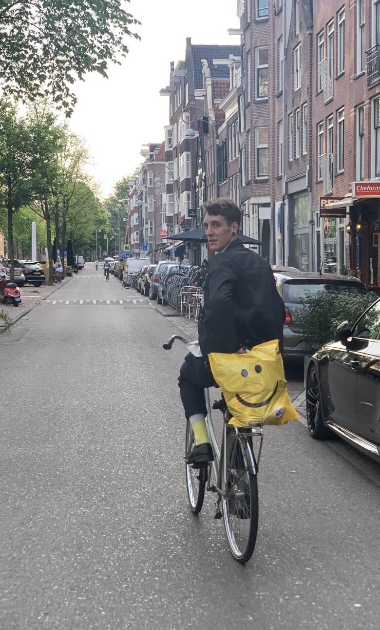 Maxime riding his bike in Amsterdam
